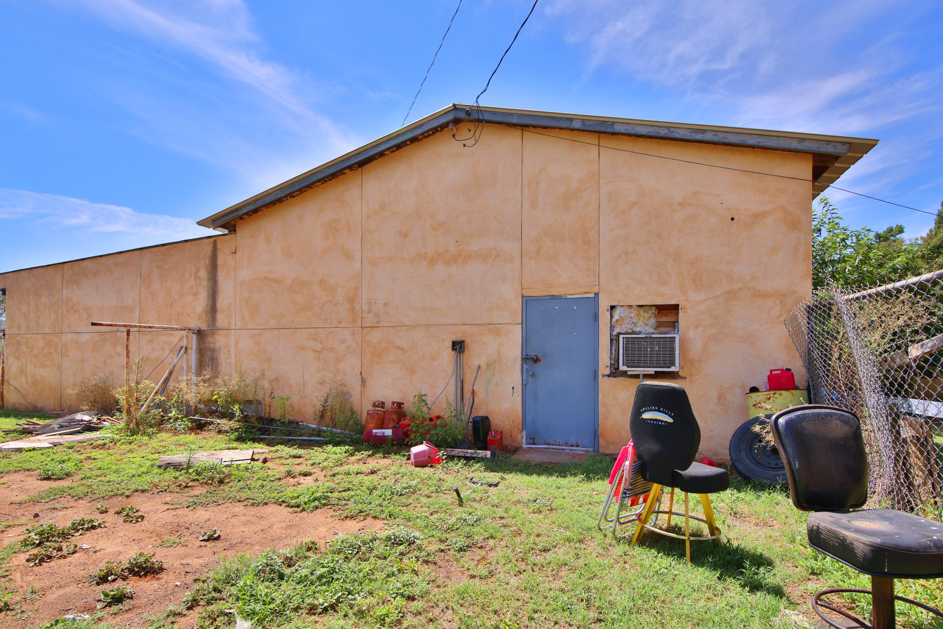 1211 140th Street Lubbock, TX 79423 - Photo 41 of 48 a backyard of a house with yard and outdoor seating