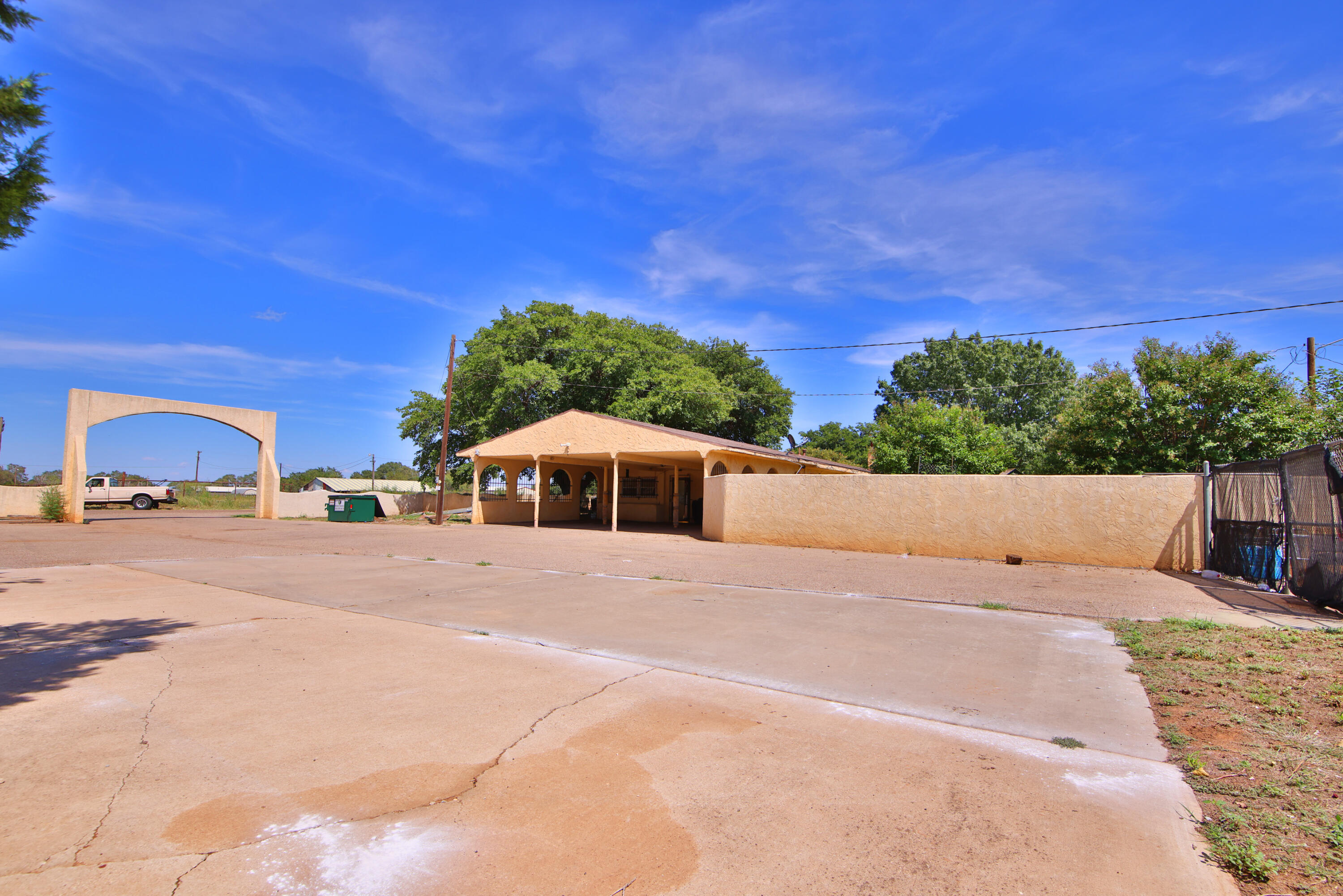 1211 140th Street Lubbock, TX 79423 - Photo 46 of 48 a view of a house with a yard and large trees