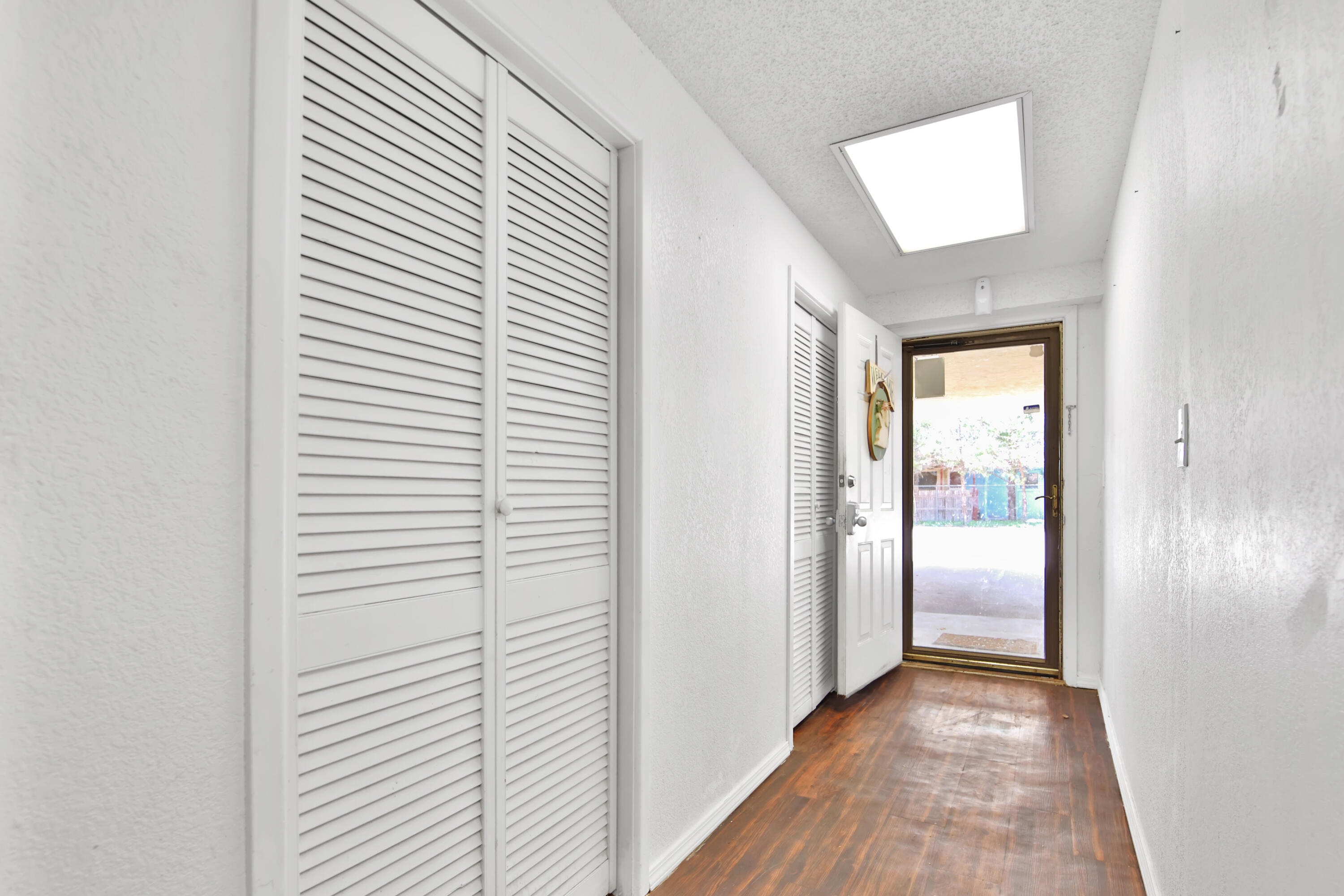 1211 140th Street Lubbock, TX 79423 - Photo 10 of 48 a view of a hallway with wooden floor