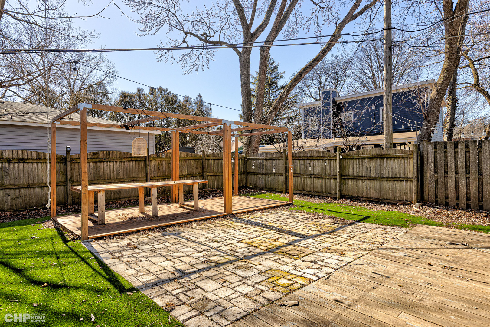 2016 Main Street Evanston, IL 60202 - Photo 4 of 8 a view of a backyard with a wooden fence