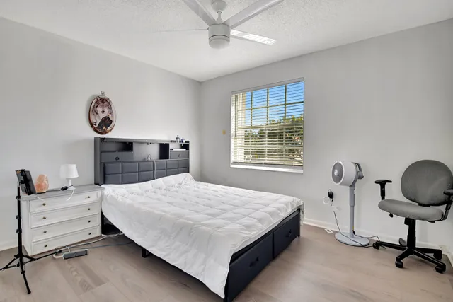 a bedroom with a bed and dresser