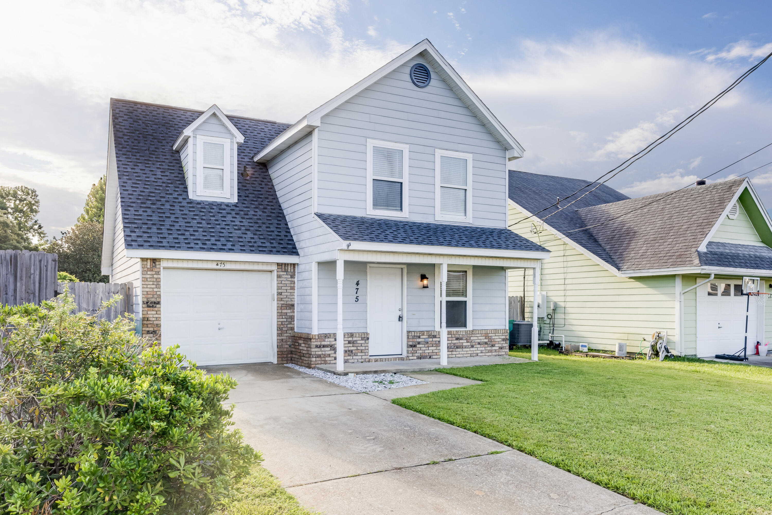front view of a house with a yard