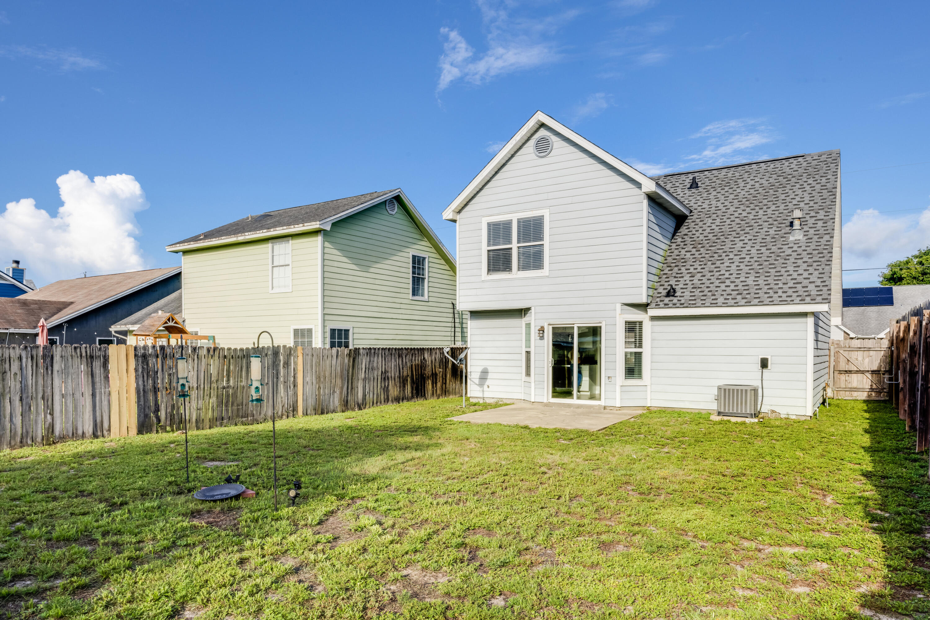 475 Sandy Ridge Circle Mary Esther, FL 32569 - Photo 23 of 26 a view of a house with backyard and a garden
