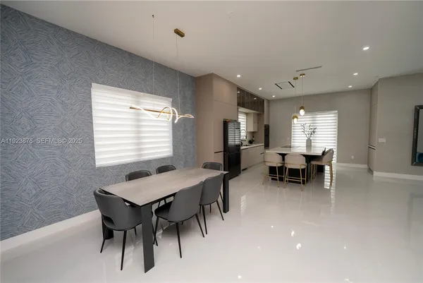 a view of a dining room with furniture and window