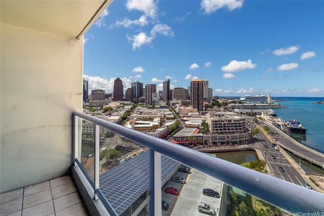 a view of roof deck with dining table and chairs
