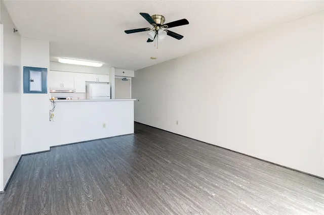 a view of a kitchen with a dishwasher and wooden floor