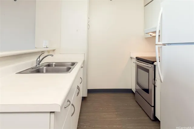 a utility room with sink dryer and washer