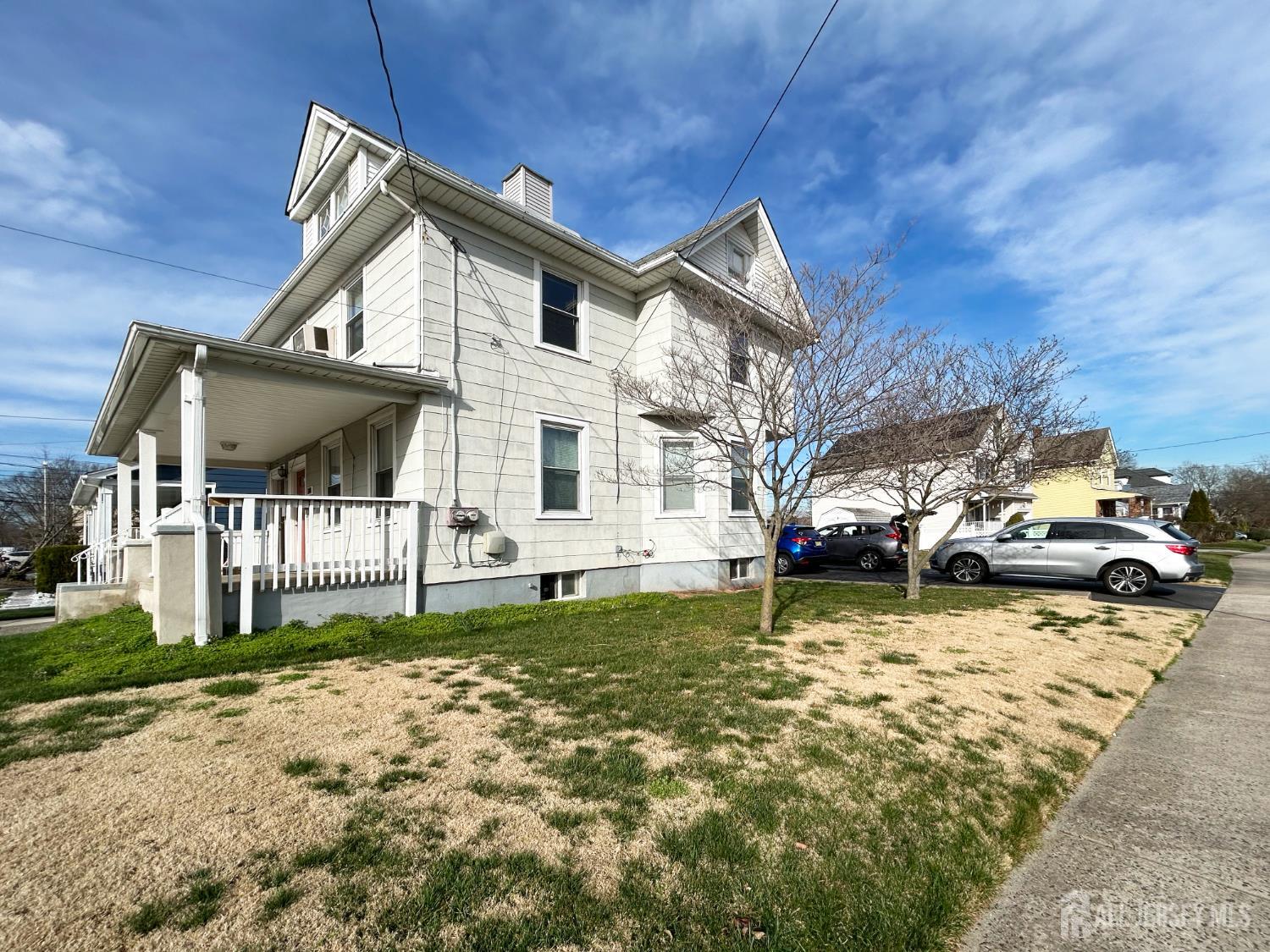 104 Thompson Street Raritan, NJ 08869 - Photo 2 of 10 a view of a house with a yard