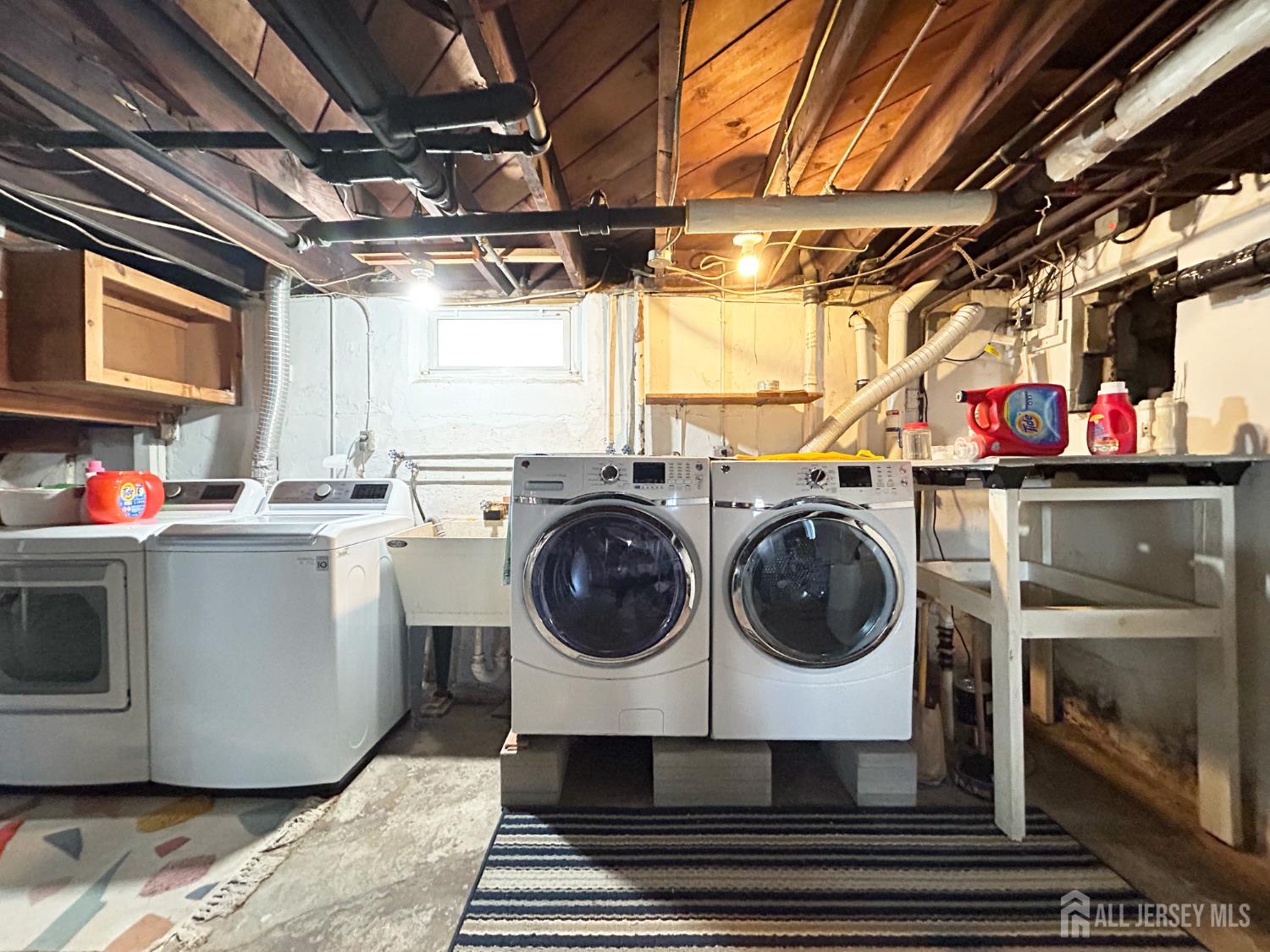 104 Thompson Street Raritan, NJ 08869 - Photo 10 of 10 a utility room with a washer and dryer