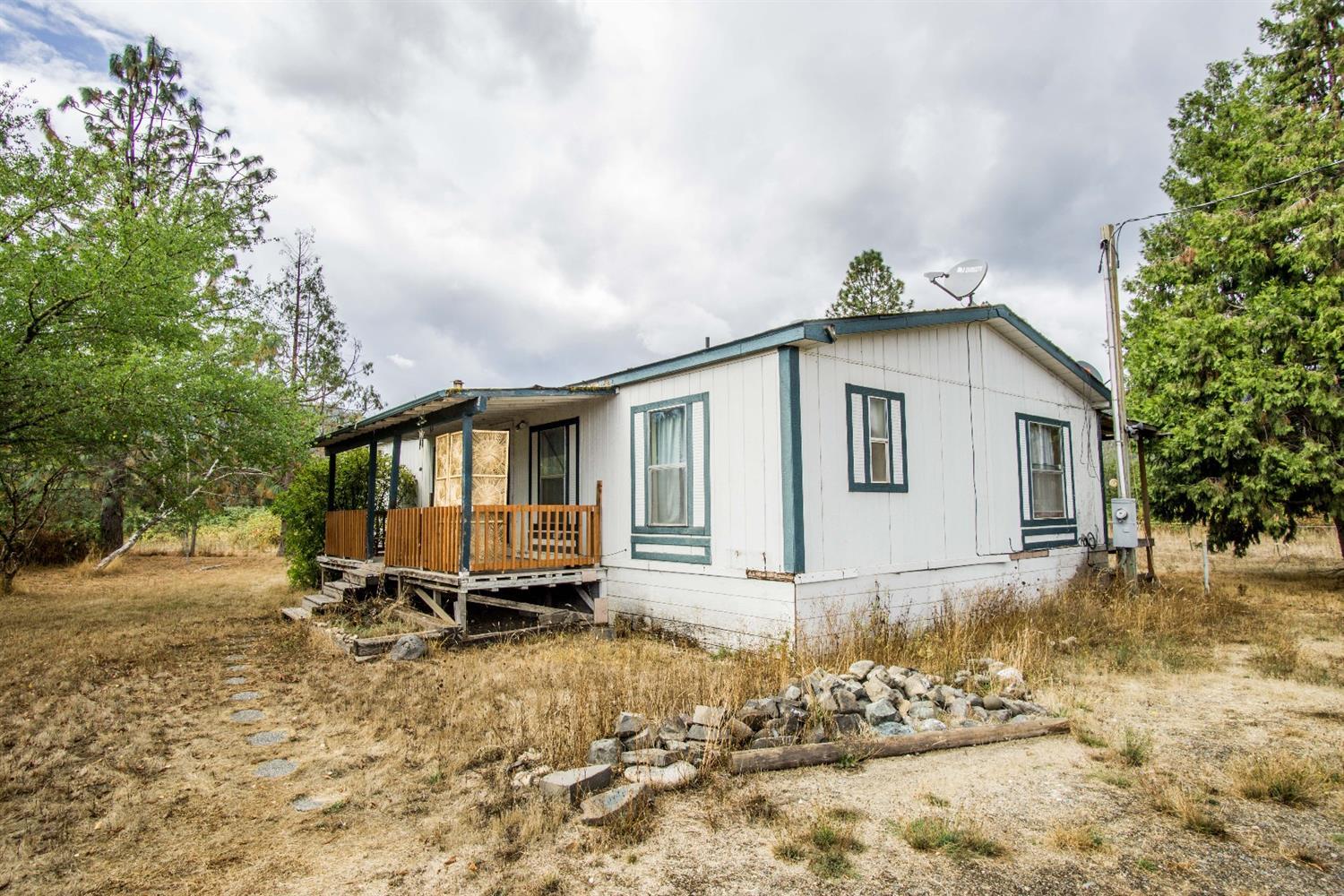 445 Cow Creek Road Riddle, OR 97469 - Photo 28 of 35 a front view of a house with a yard