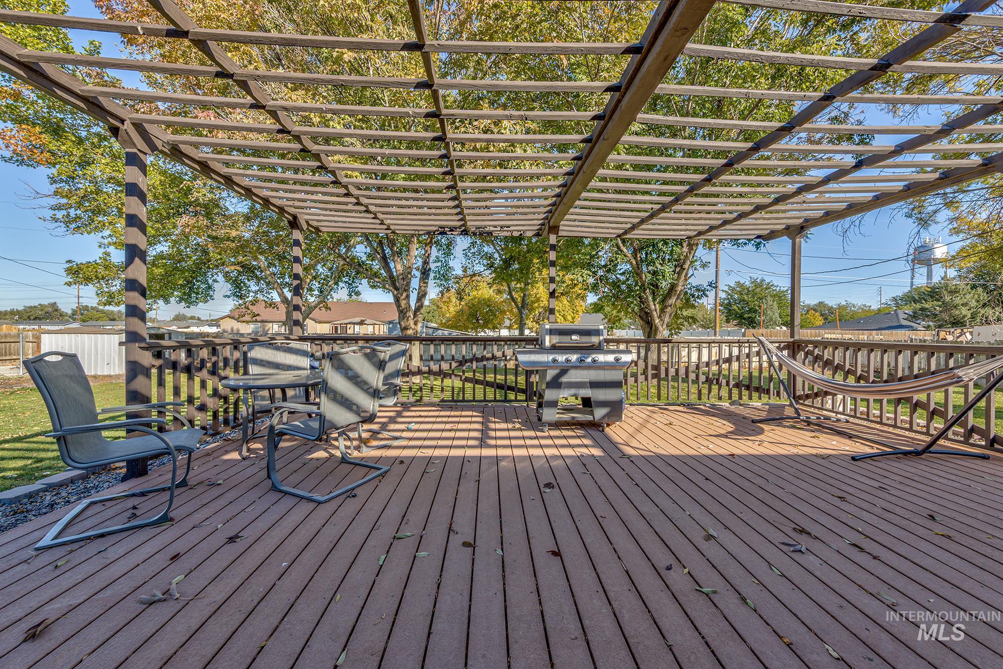 710 North 5th Street Nyssa, OR 97913 - Photo 27 of 36 Wooden deck featuring area for grilling and a lawn