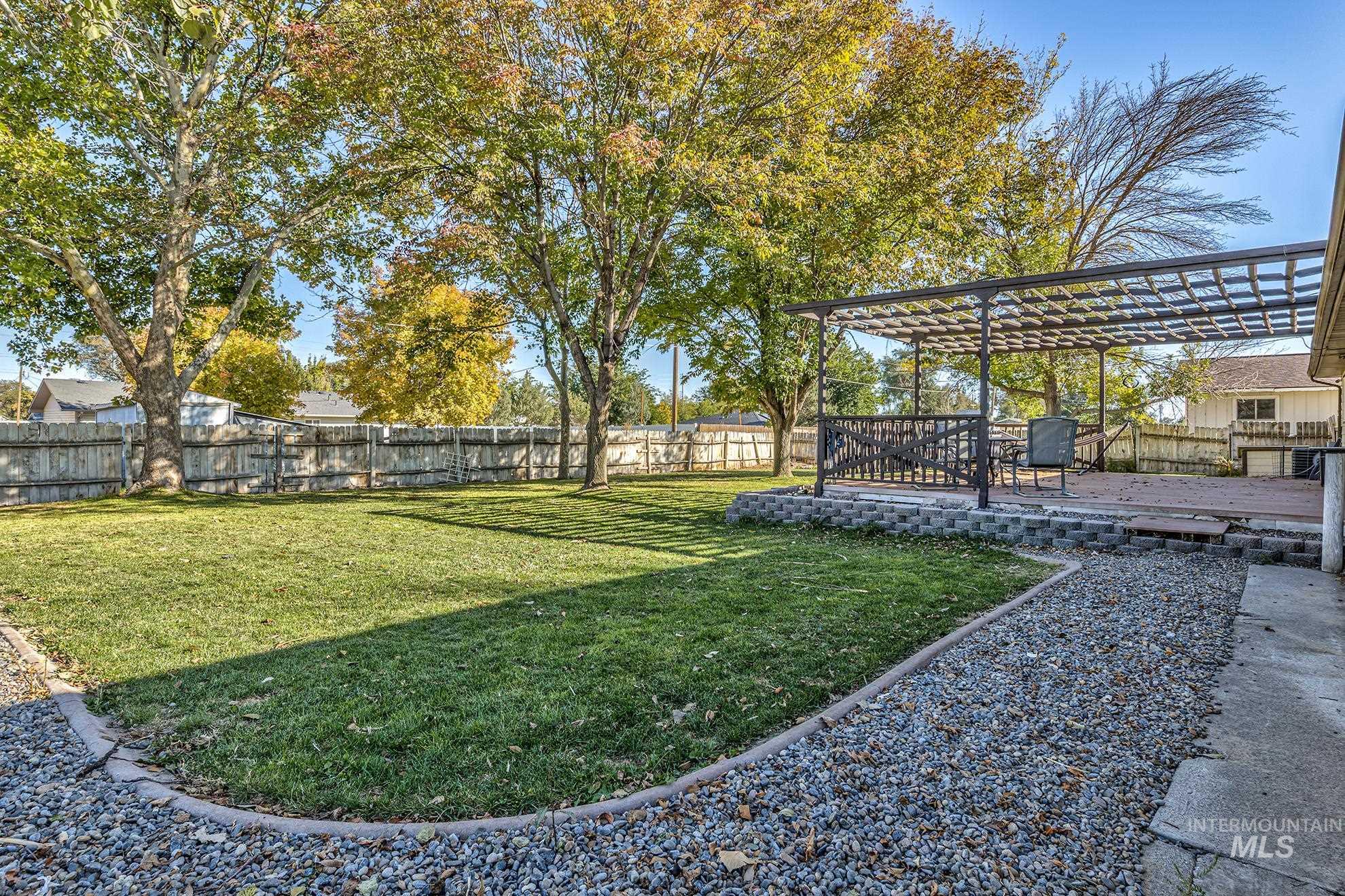 710 North 5th Street Nyssa, OR 97913 - Photo 32 of 36 Fenced backyard featuring a deck