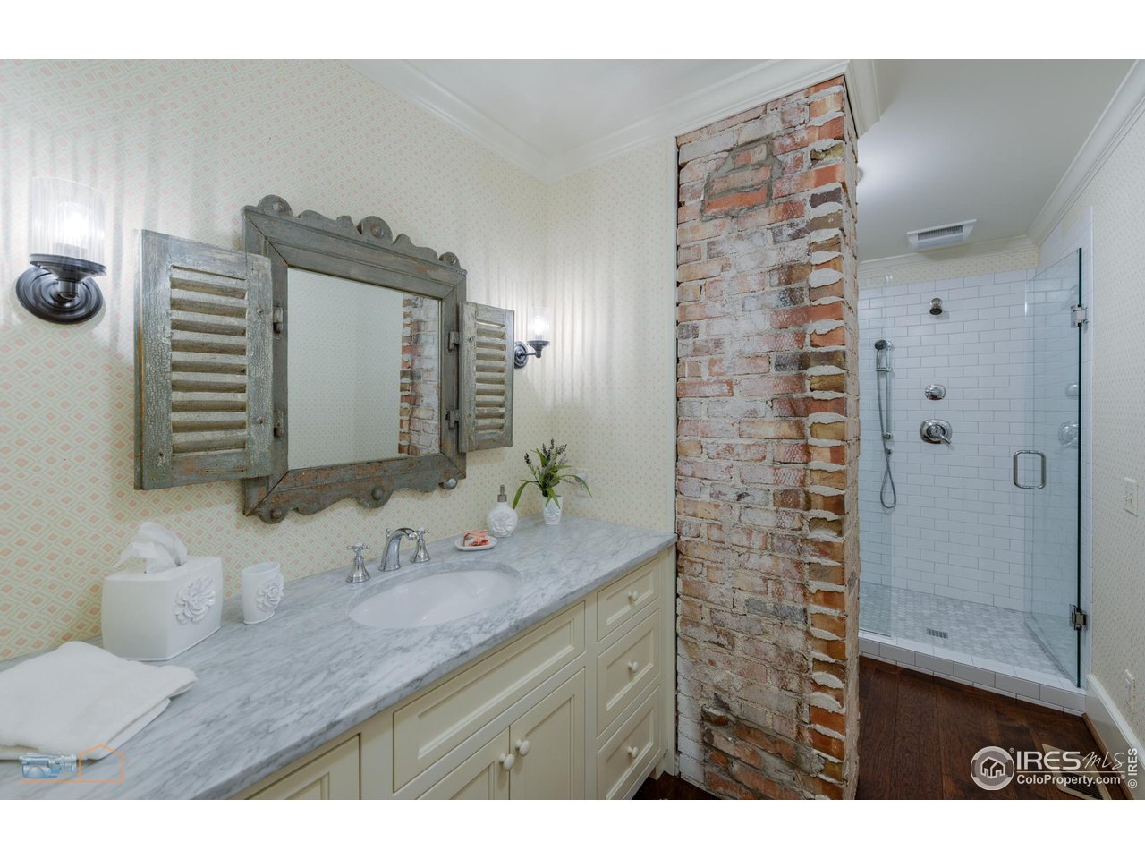 8522 Valmont Road Boulder, CO 80301 - Photo 18 of 49 a bathroom with a granite countertop sink a mirror and shower