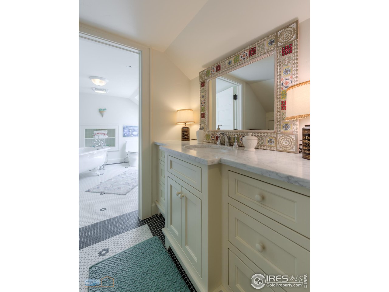 8522 Valmont Road Boulder, CO 80301 - Photo 22 of 49 a bathroom with a granite countertop sink and a mirror