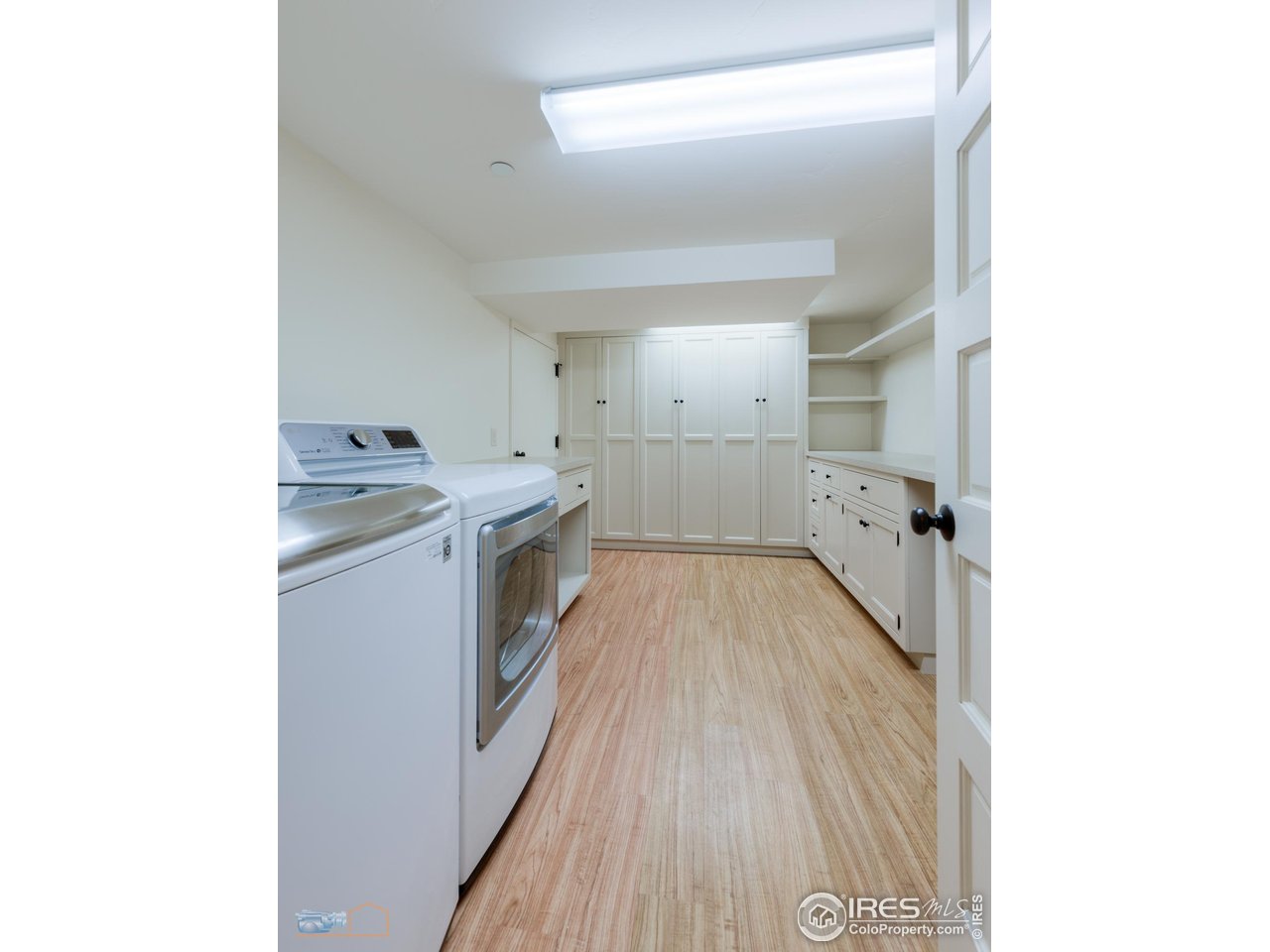 8522 Valmont Road Boulder, CO 80301 - Photo 24 of 49 a view of a kitchen with a sink and wooden floor