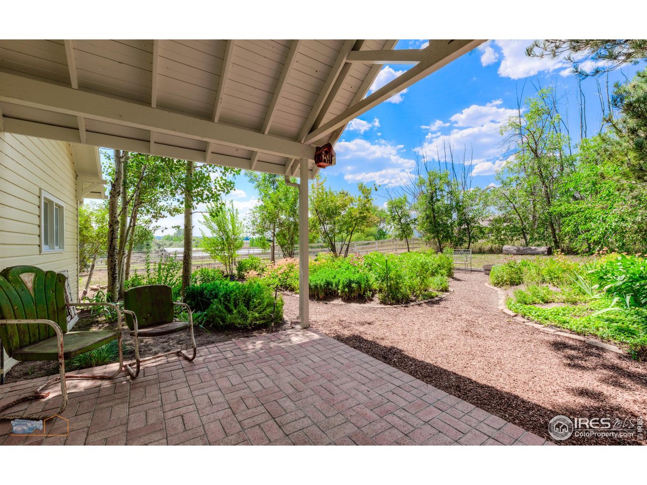 8522 Valmont Road Boulder, CO 80301 - Photo 29 of 49 a backyard of a house with a garden and outdoor seating