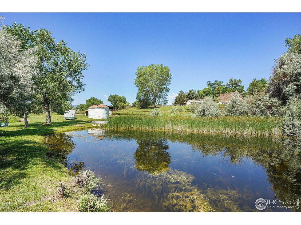 8522 Valmont Road Boulder, CO 80301 - Photo 37 of 49 a view of a lake with a yard