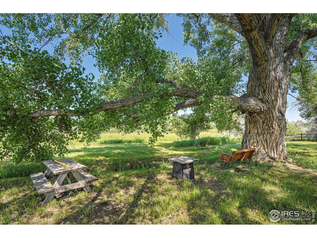 8522 Valmont Road Boulder, CO 80301 - Photo 44 of 49 a backyard of a house with a yard and outdoor seating