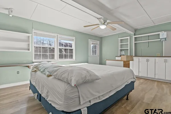 a bedroom with a bed and window