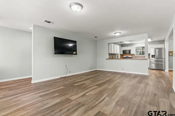 a view of a kitchen with a sink and a microwave