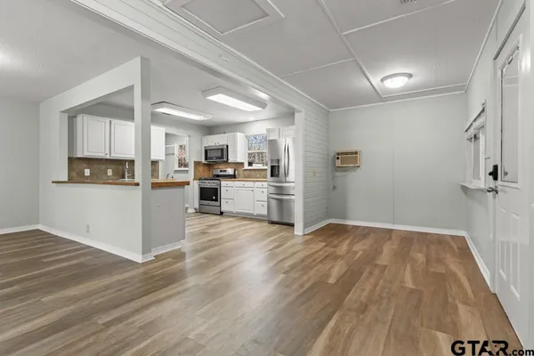 a view of kitchen with wooden floor
