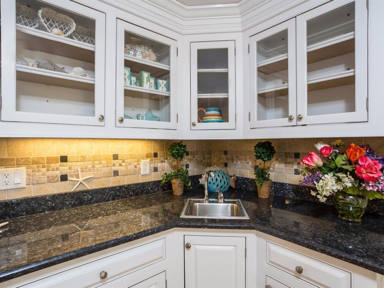 108 Fells Pond Road Mashpee, MA 02649 - Photo 12 of 35 a kitchen with a sink and cabinets