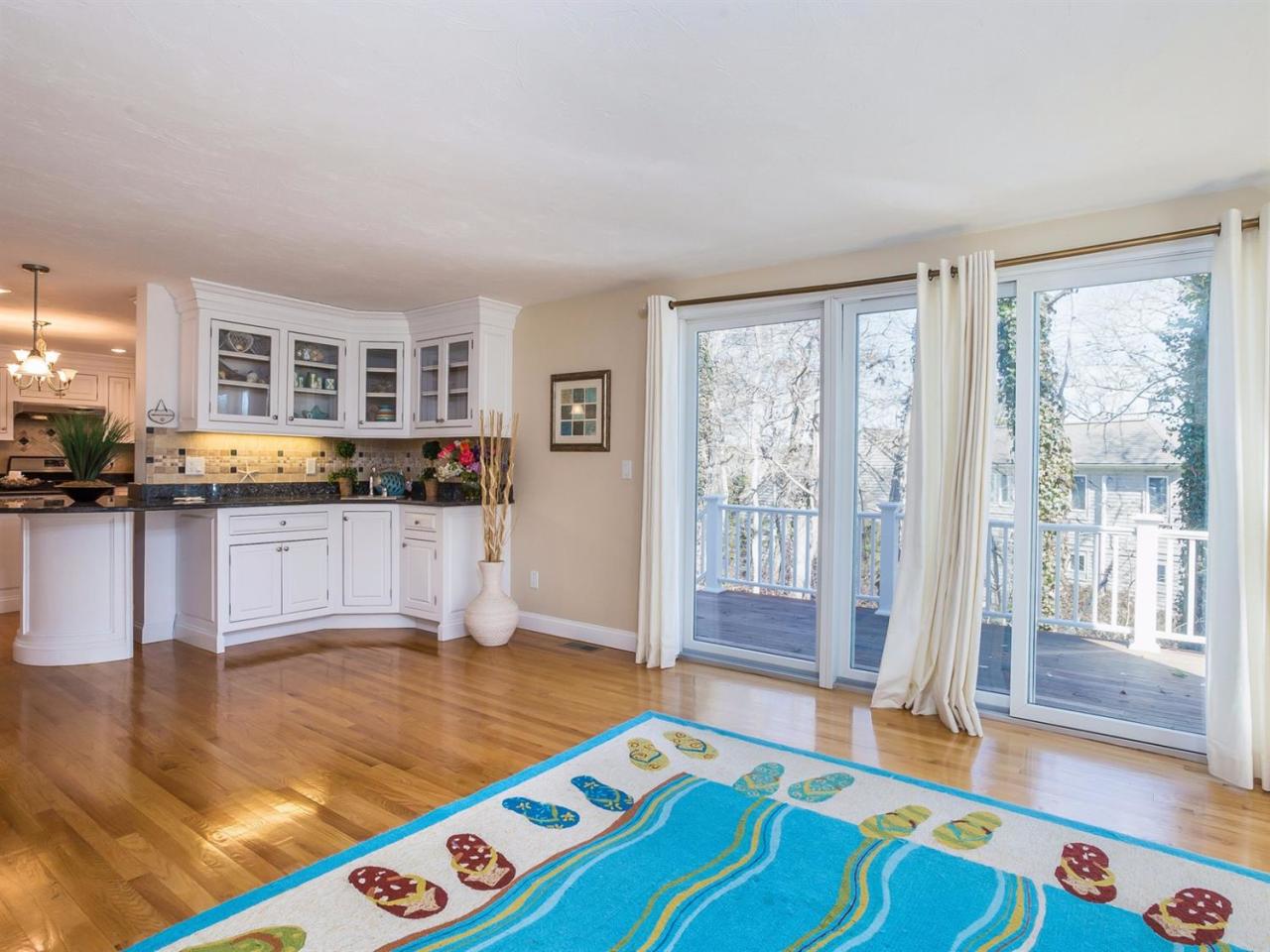 108 Fells Pond Road Mashpee, MA 02649 - Photo 13 of 35 a room with kitchen island granite countertop furniture and a wooden floor