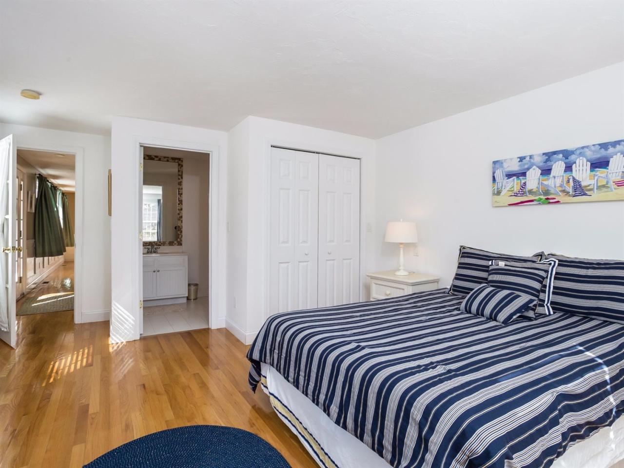 108 Fells Pond Road Mashpee, MA 02649 - Photo 16 of 35 a bedroom with a bed and painting on the wall