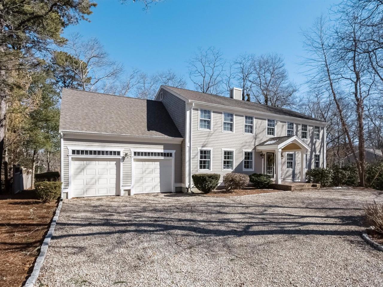 108 Fells Pond Road Mashpee, MA 02649 - Photo 2 of 35 a front view of a house with a yard