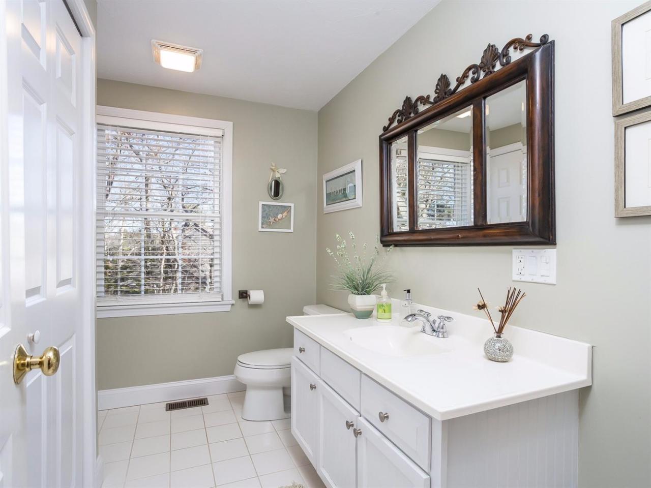108 Fells Pond Road Mashpee, MA 02649 - Photo 24 of 35 a bathroom with a sink toilet and a mirror