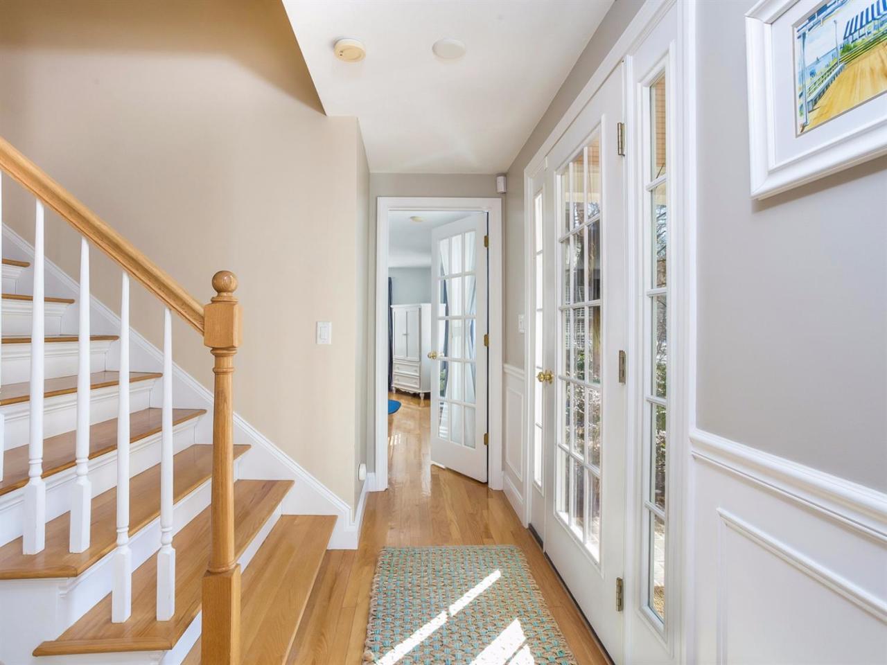 108 Fells Pond Road Mashpee, MA 02649 - Photo 5 of 35 a view of a hallway with wooden floor and staircase