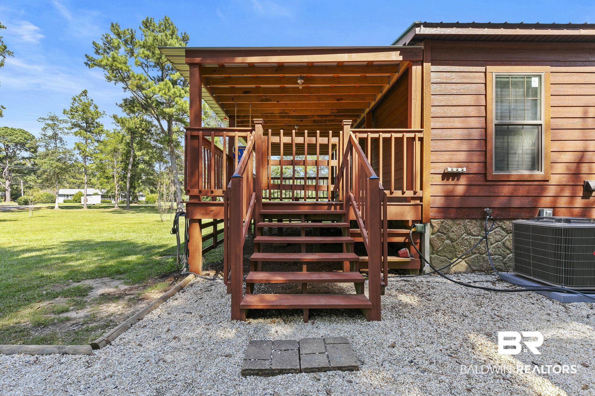 35641 County Road 39 Stapleton, AL 36578 - Photo 8 of 46 Exterior space with a lawn, cooling unit, and a wooden deck