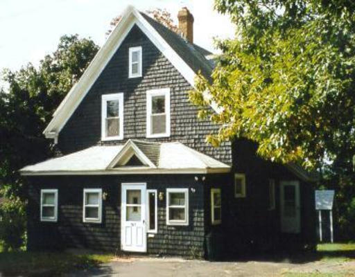 23 Wrentham Road Worcester, MA 01602 - Photo 1 of 1 a front view of a house with a garden