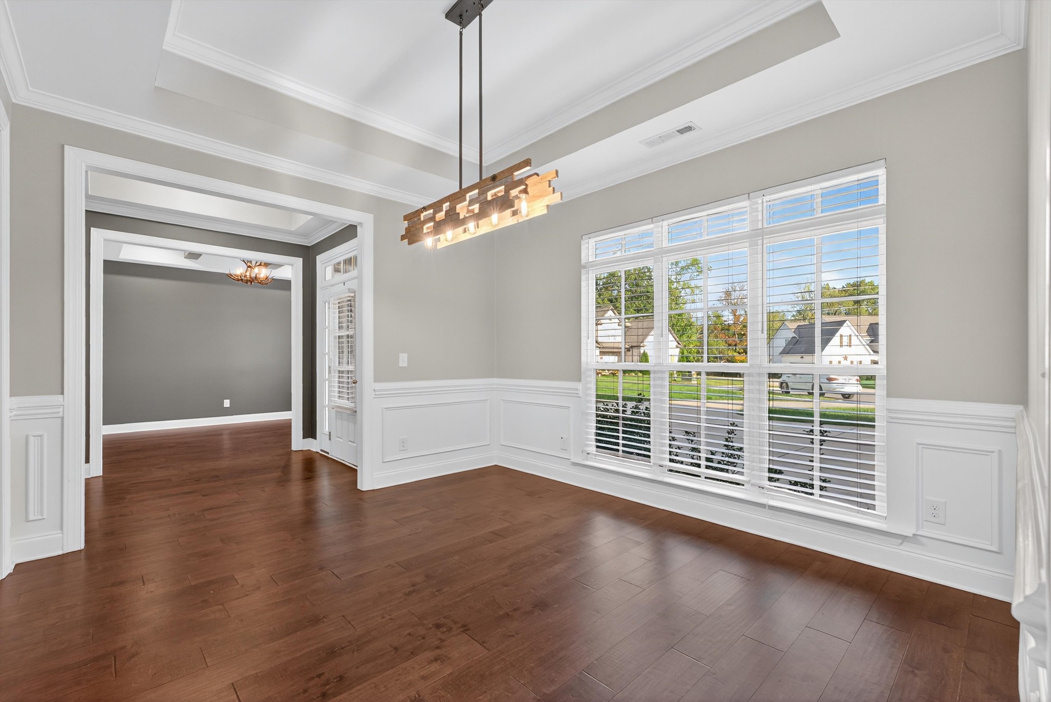 7401 Swindon Boulevard Fairview, TN 37062 - Photo 12 of 57 a view of an empty room with wooden floor kitchen view and a window