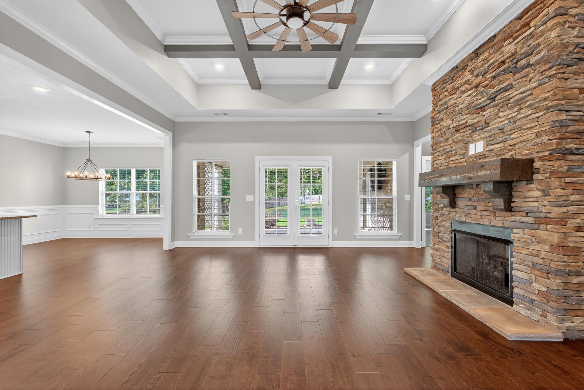7401 Swindon Boulevard Fairview, TN 37062 - Photo 13 of 57 a view of an empty room with wooden floor and a fireplace