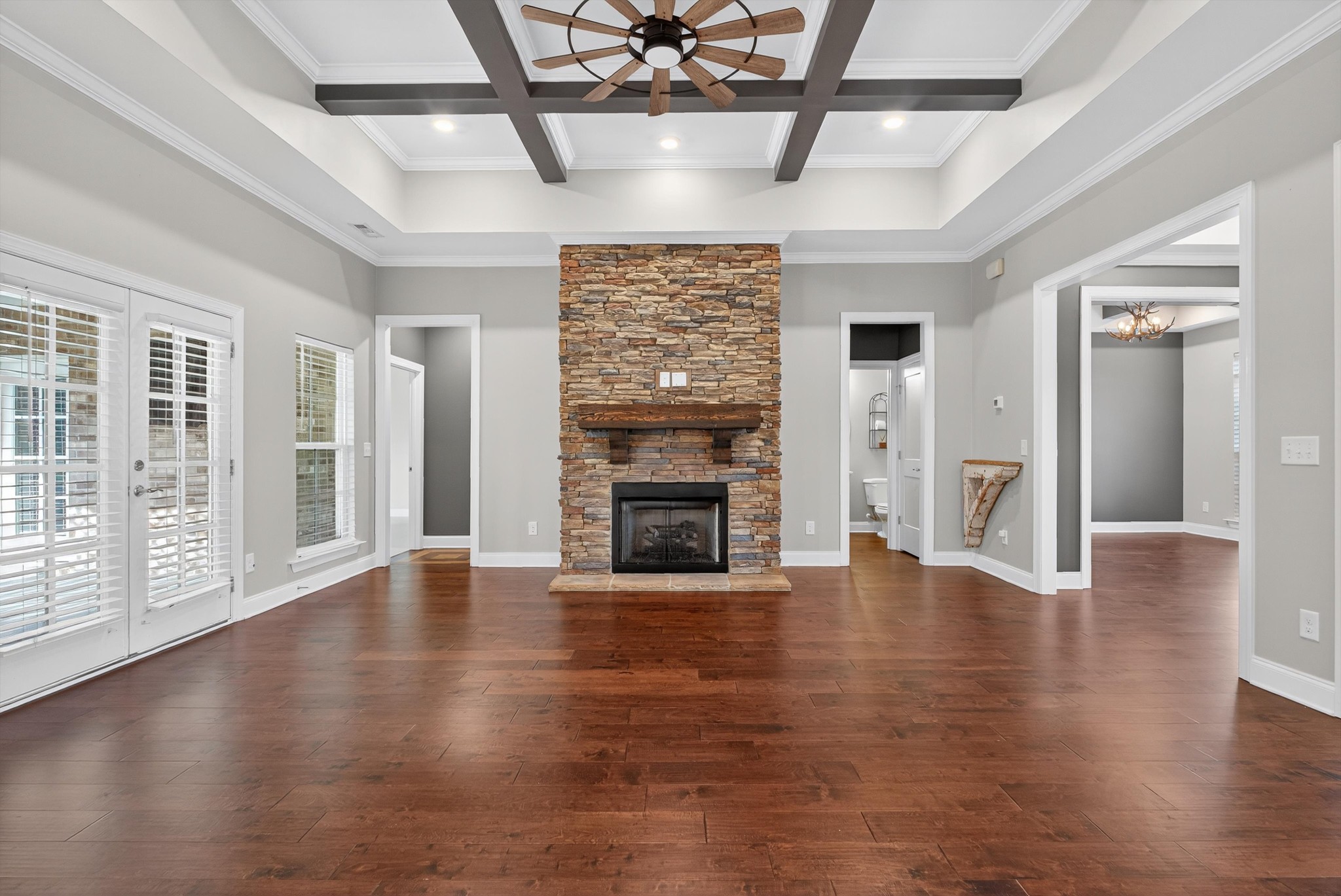 7401 Swindon Boulevard Fairview, TN 37062 - Photo 18 of 57 a view of an empty room with wooden floor fireplace and a window