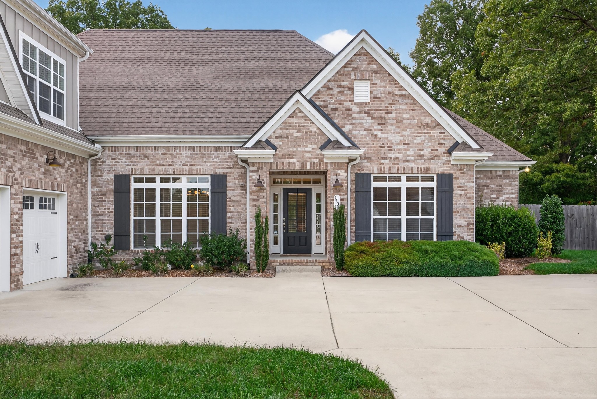7401 Swindon Boulevard Fairview, TN 37062 - Photo 2 of 57 a front view of a house with garden
