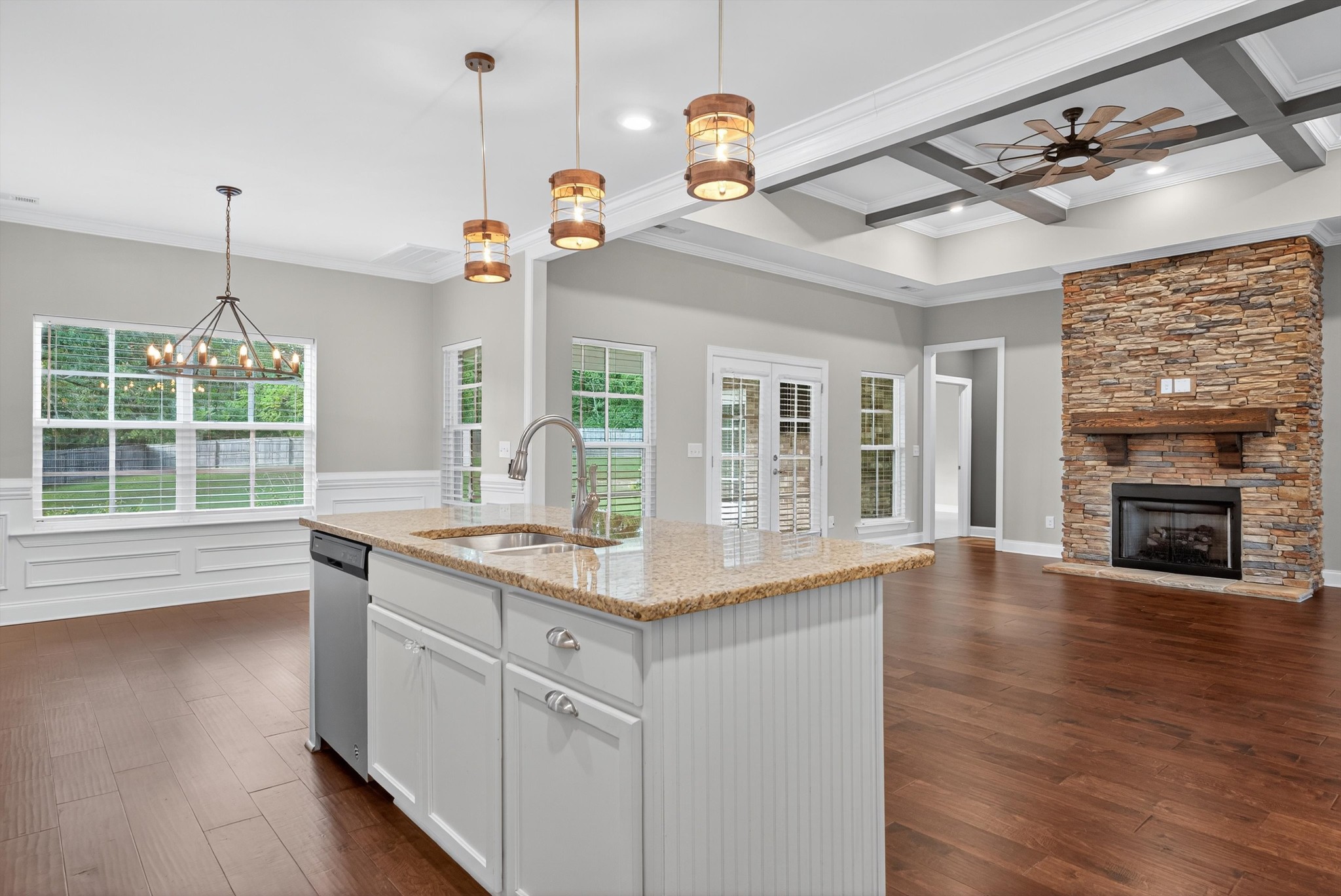 7401 Swindon Boulevard Fairview, TN 37062 - Photo 23 of 57 a kitchen with kitchen island granite countertop a stove a sink a center island and wooden floor