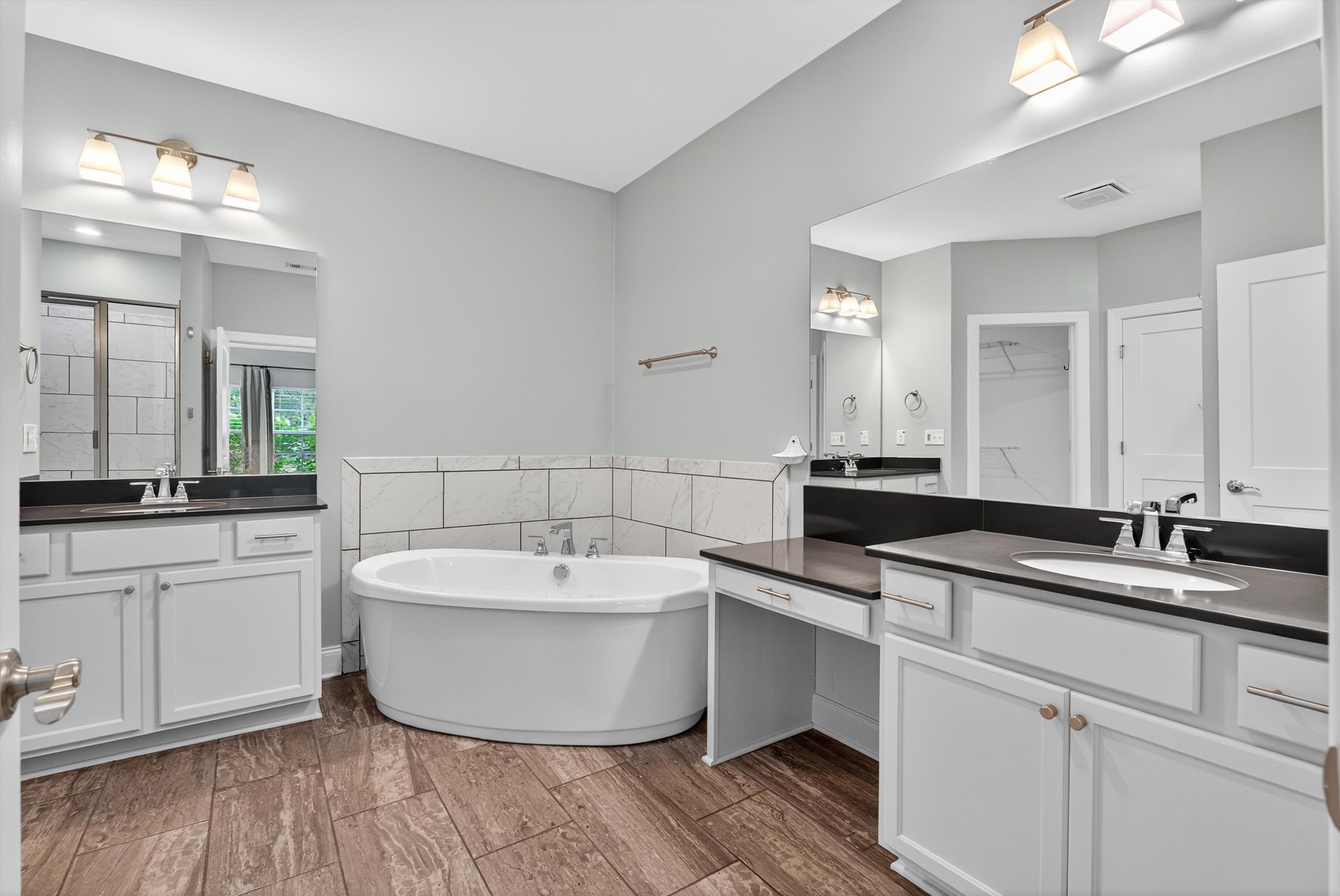 7401 Swindon Boulevard Fairview, TN 37062 - Photo 31 of 57 a spacious bathroom with a double vanity sink mirror and bathtub