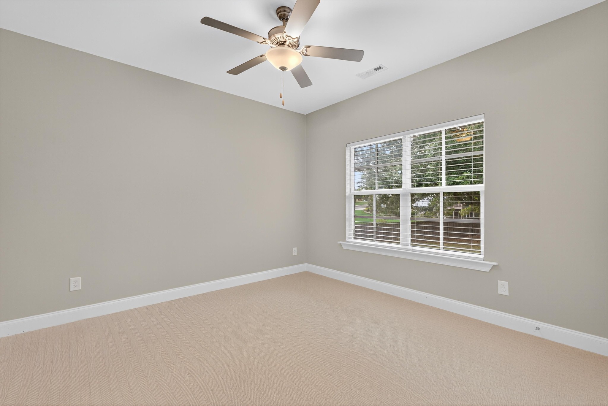 7401 Swindon Boulevard Fairview, TN 37062 - Photo 35 of 57 an empty room with a window and a fan