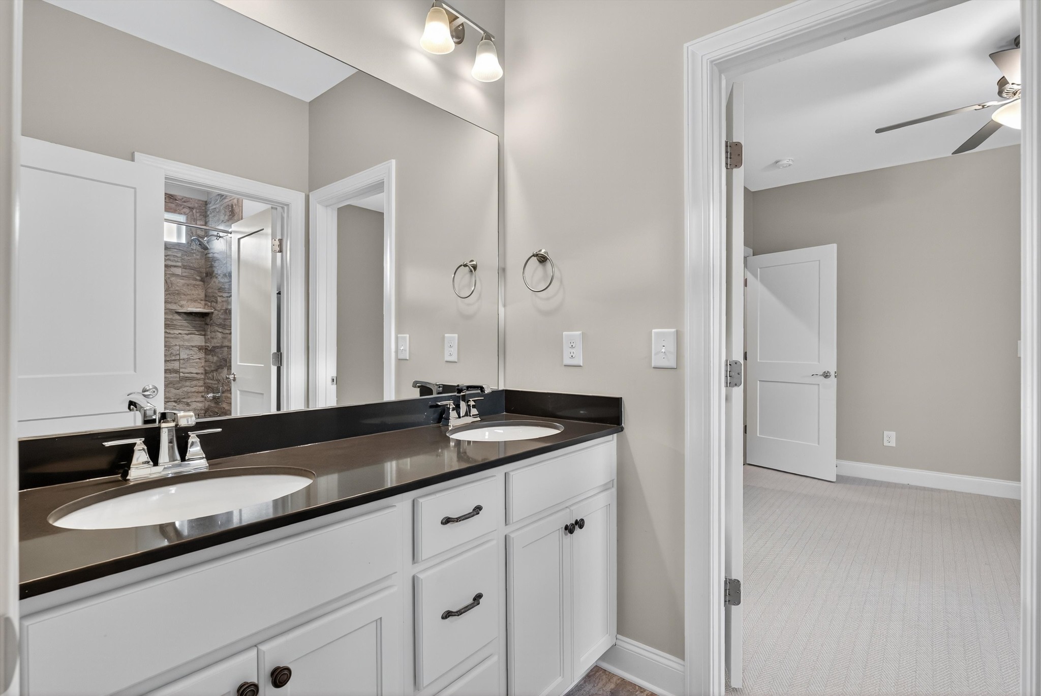 7401 Swindon Boulevard Fairview, TN 37062 - Photo 37 of 57 a bathroom with a granite countertop sink and a mirror