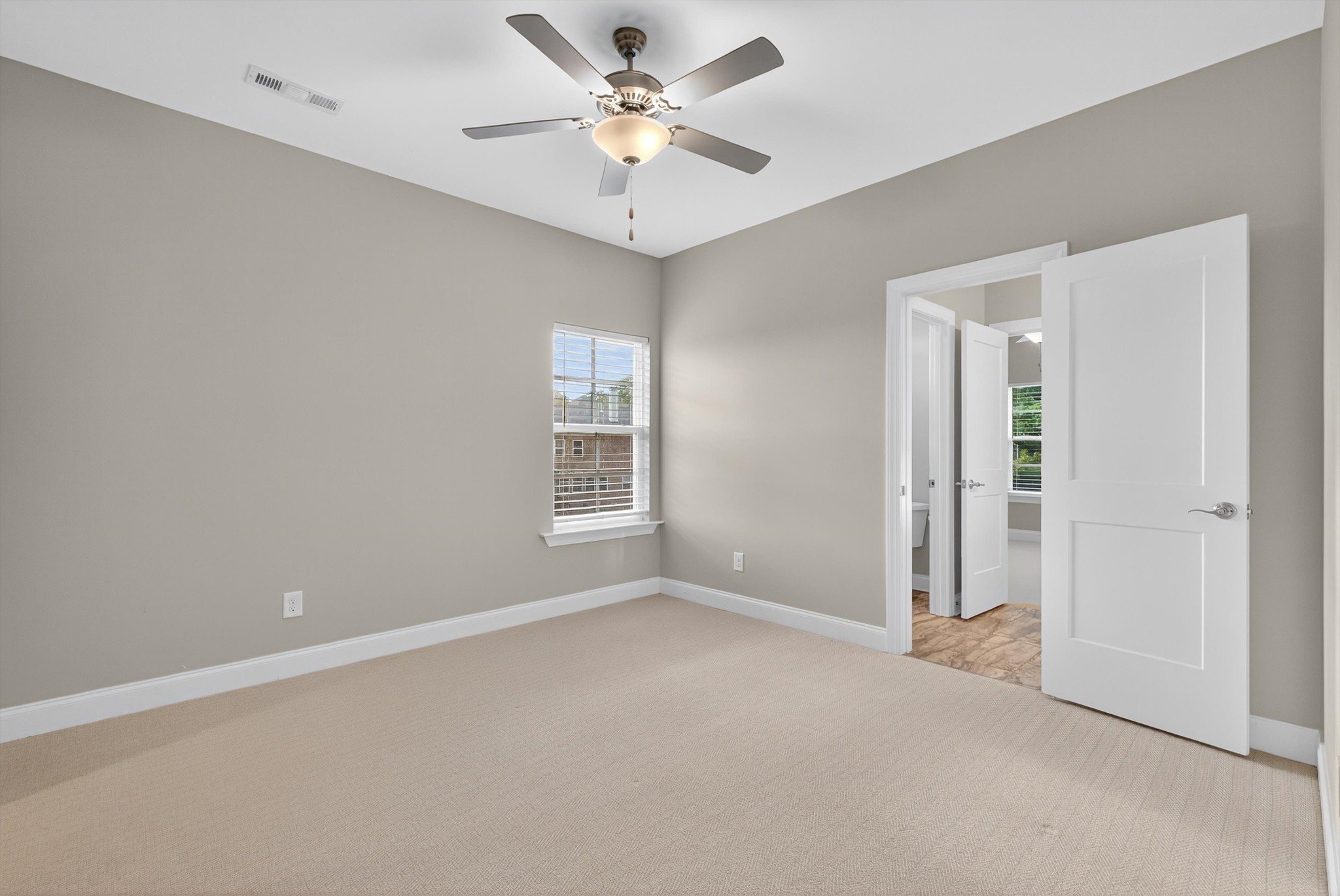 7401 Swindon Boulevard Fairview, TN 37062 - Photo 40 of 57 an empty room with windows and fan