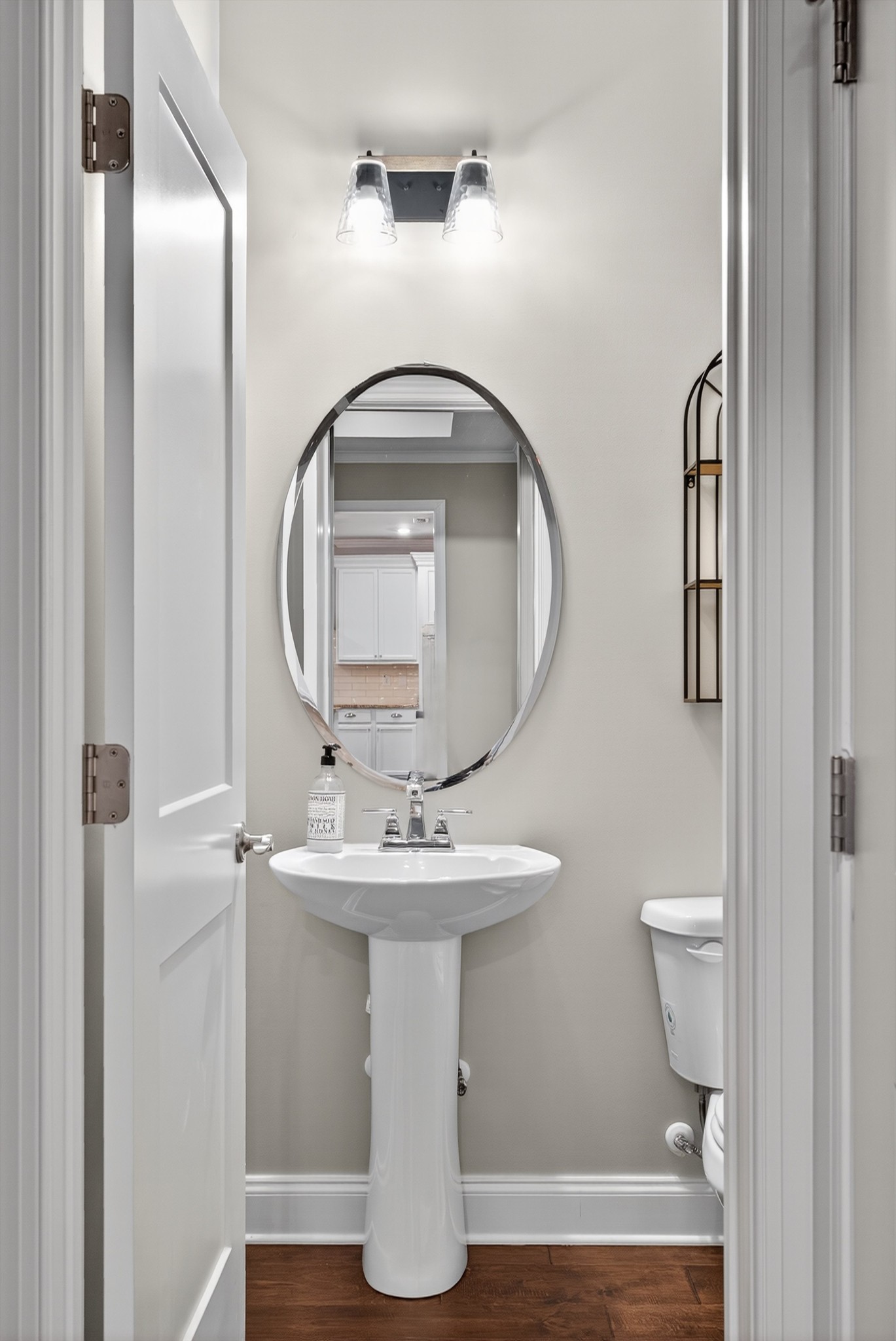 7401 Swindon Boulevard Fairview, TN 37062 - Photo 42 of 57 a bathroom with a toilet sink and mirror