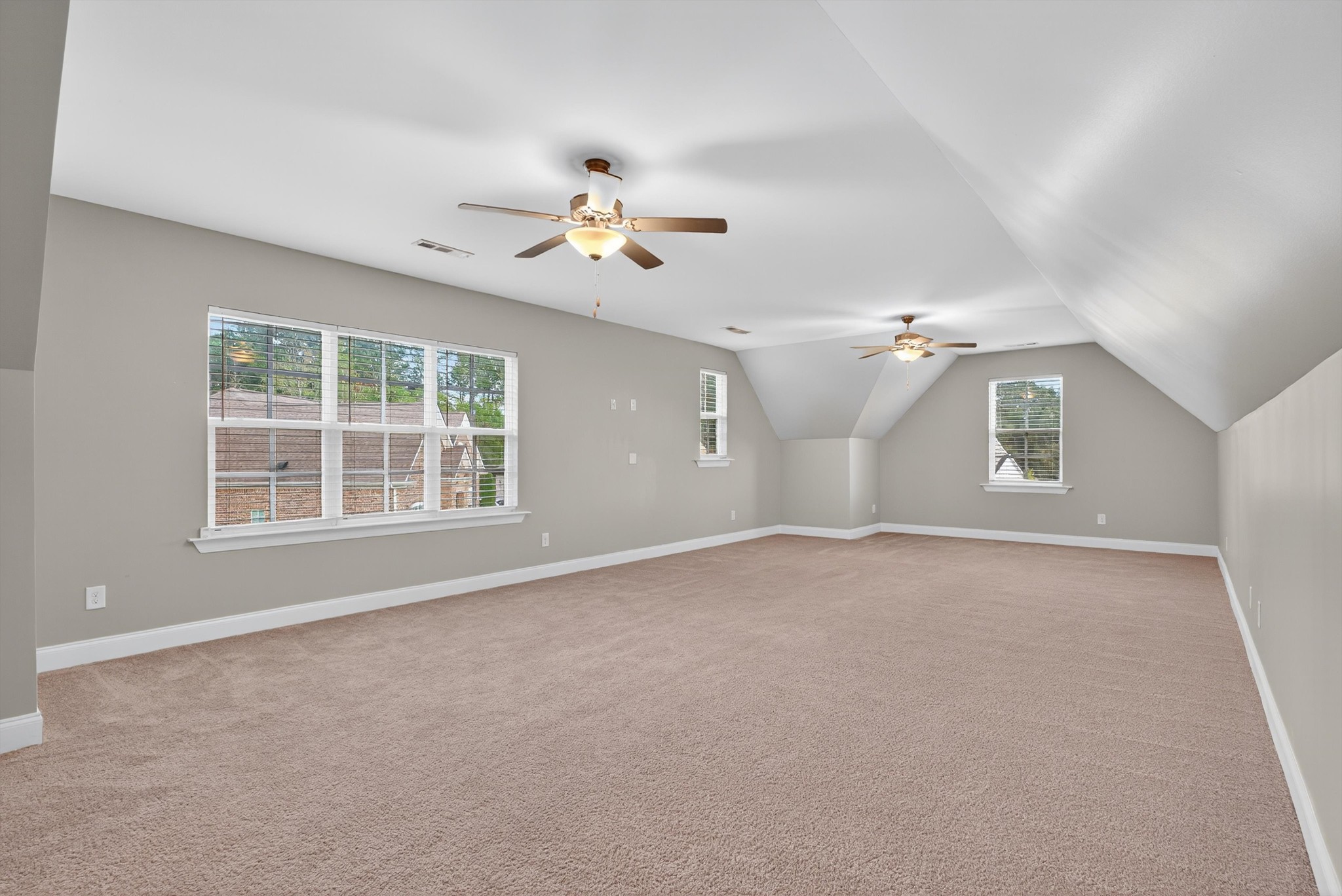 7401 Swindon Boulevard Fairview, TN 37062 - Photo 45 of 57 an empty room with windows and chandelier fan