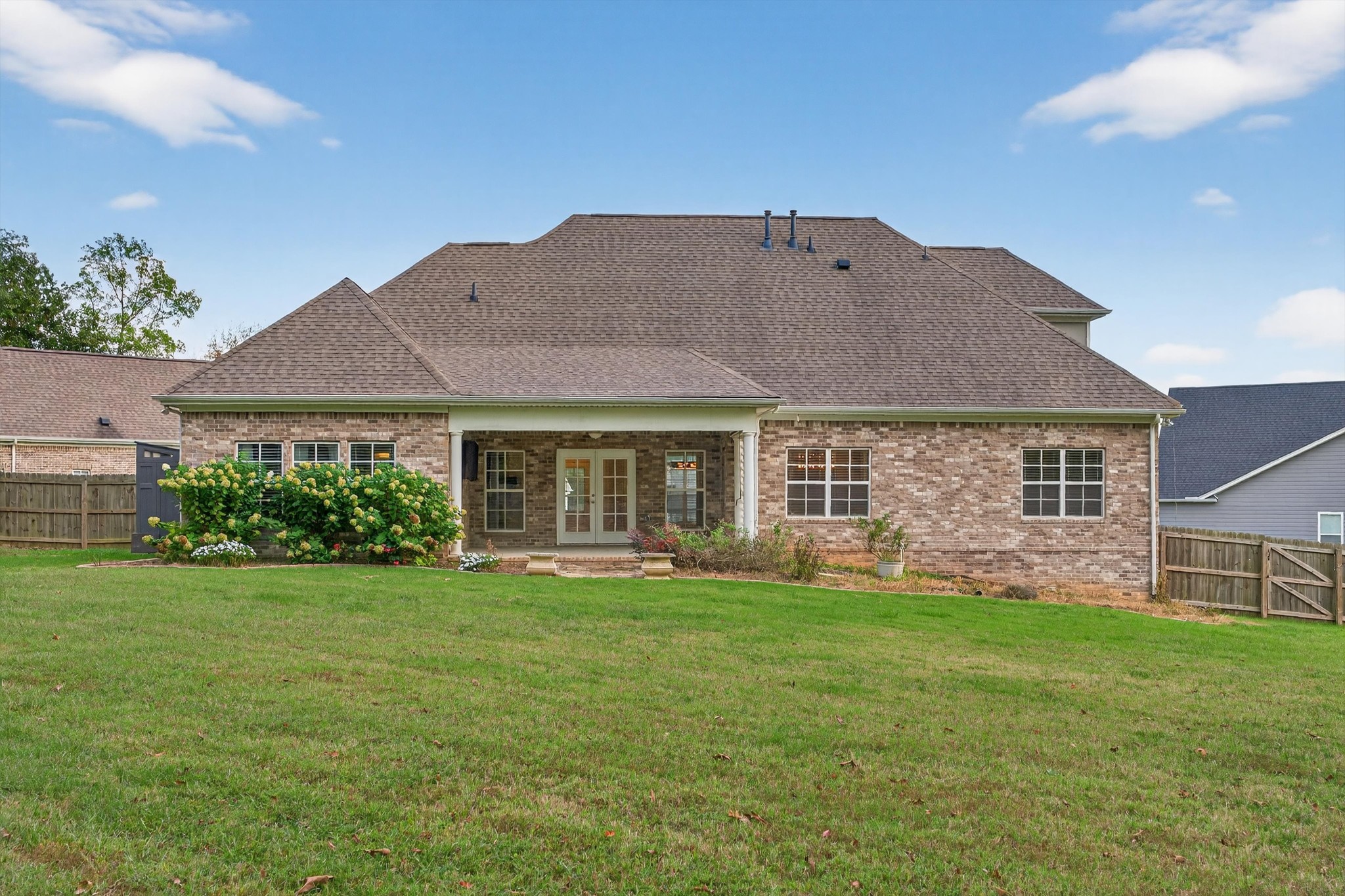 7401 Swindon Boulevard Fairview, TN 37062 - Photo 48 of 57 a front view of a house with a garden and yard