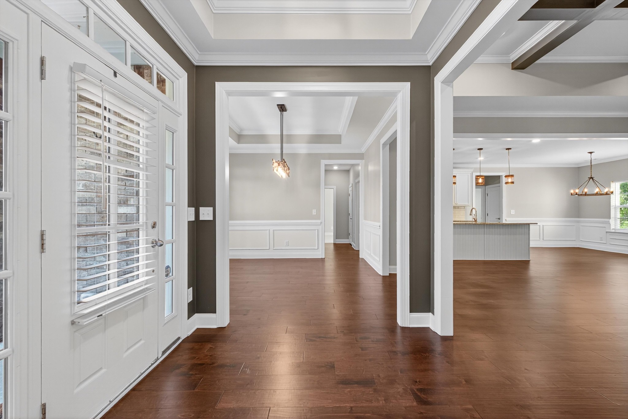 7401 Swindon Boulevard Fairview, TN 37062 - Photo 10 of 57 a view of a hallway with wooden floor windows and a cabinet