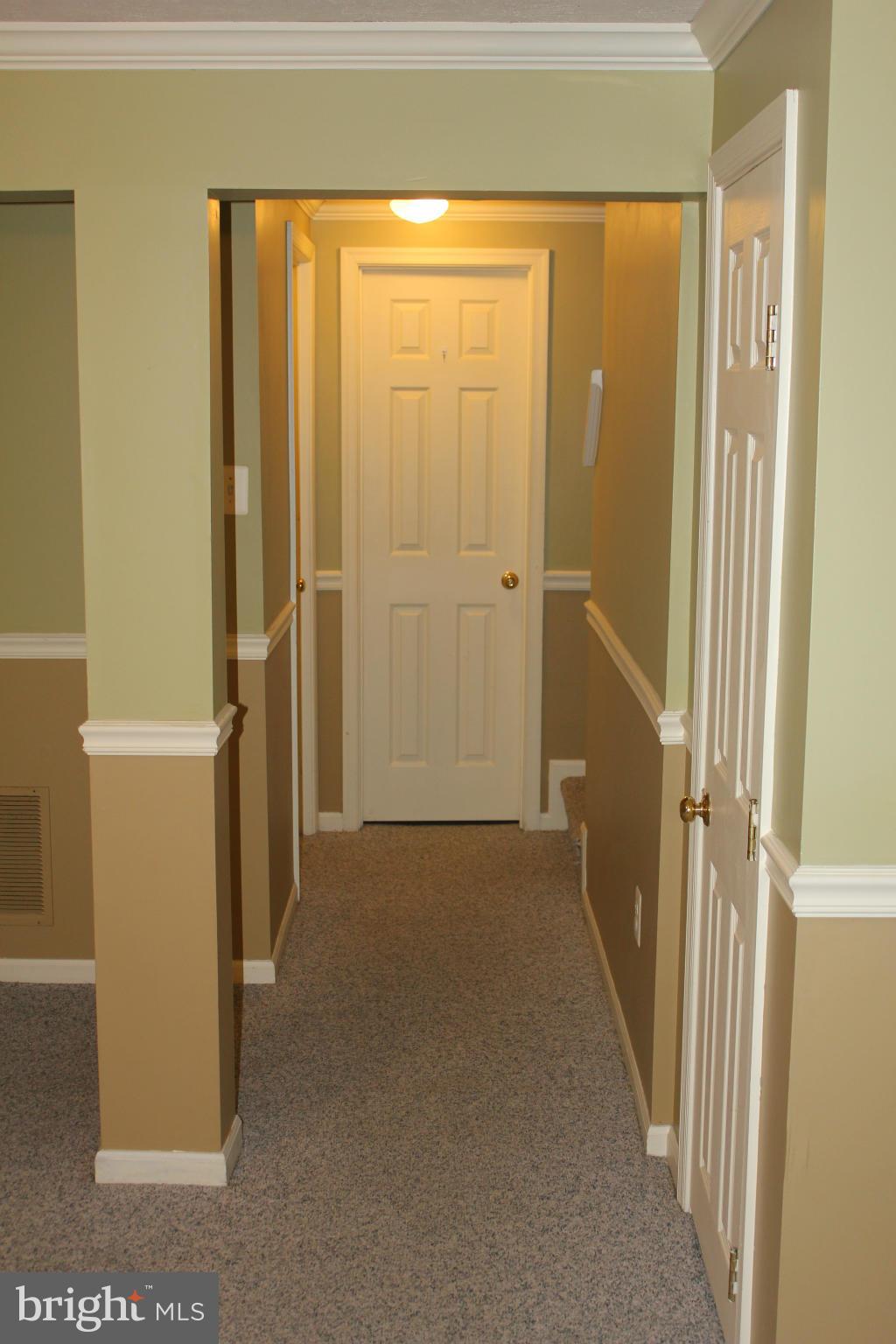 7791 Paddock Way Baltimore, MD 21244 - Photo 16 of 19 a view of a hallway with an empty room