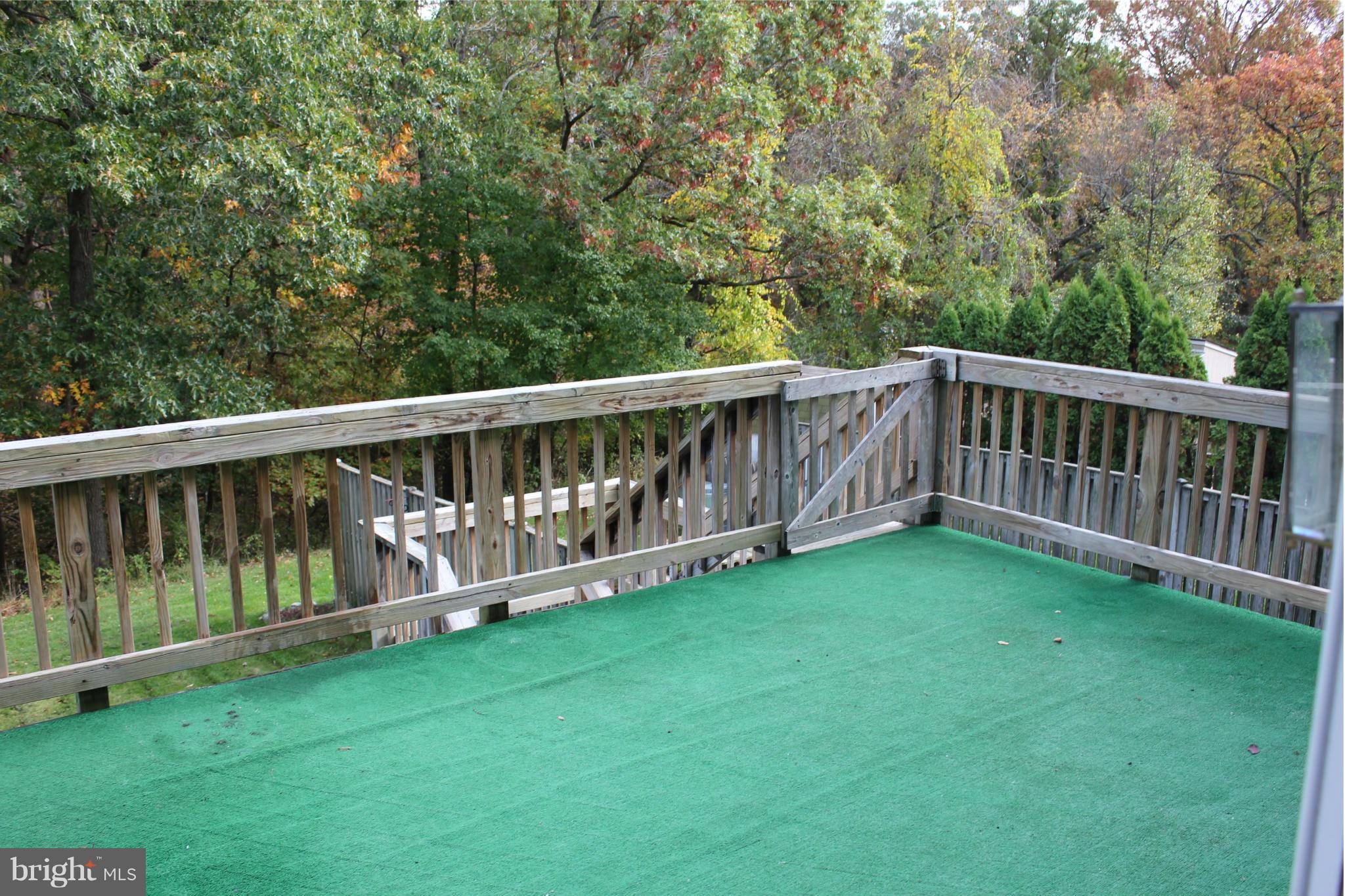 7791 Paddock Way Baltimore, MD 21244 - Photo 7 of 19 a view of a deck with a big white fence