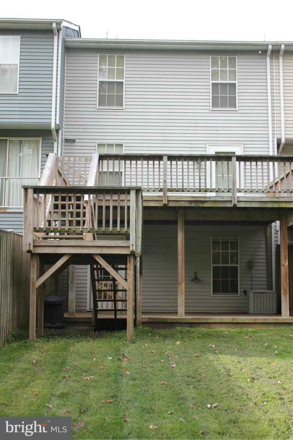 7791 Paddock Way Baltimore, MD 21244 - Photo 10 of 19 a view of a house with a garden and deck