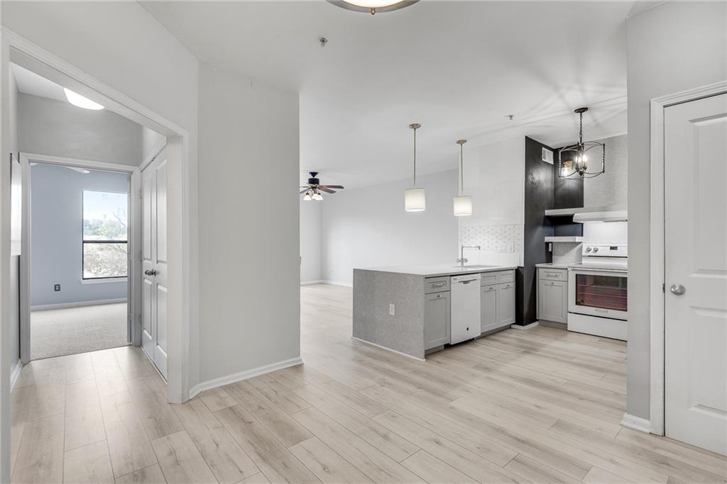 a view of kitchen with wooden floor